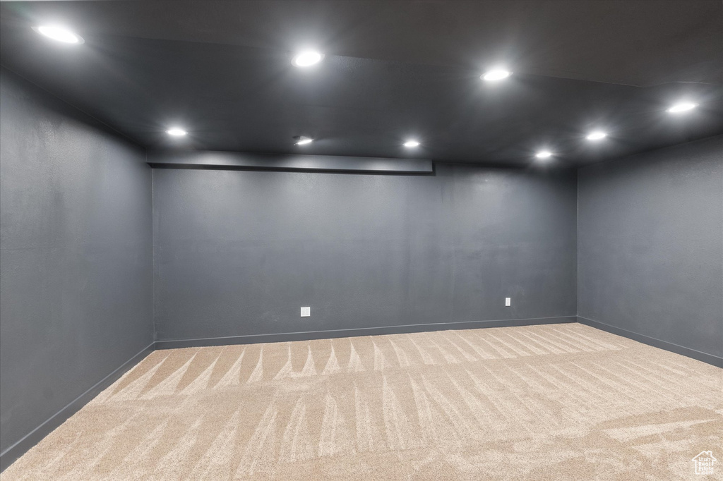 Carpeted empty room featuring baseboards and recessed lighting