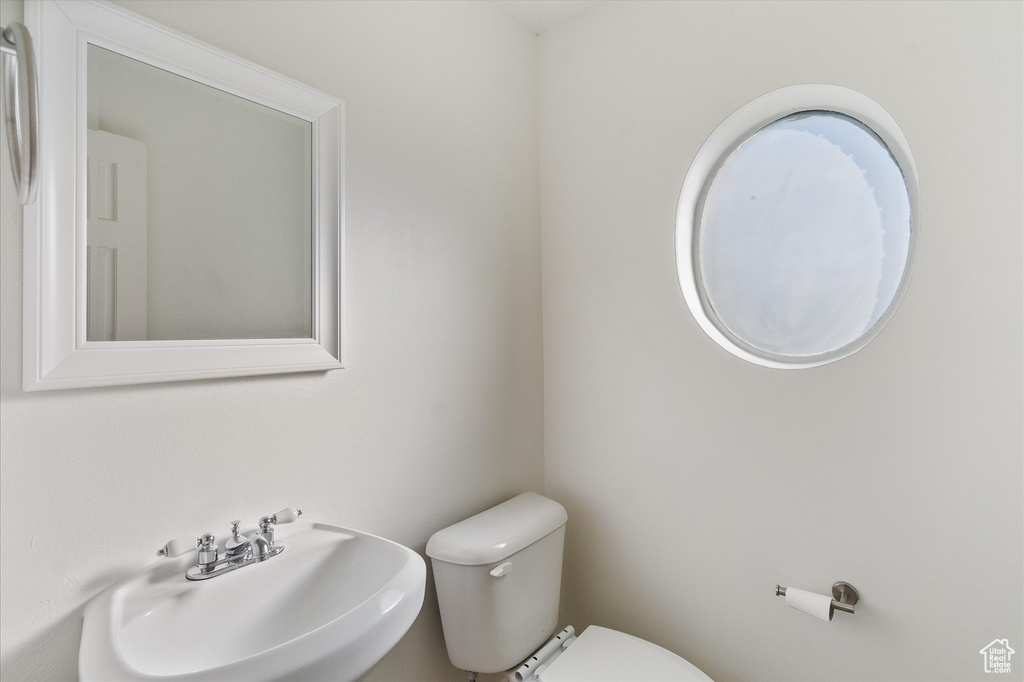Bathroom featuring toilet and a sink