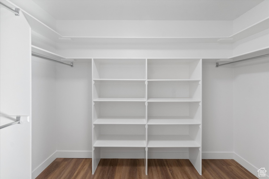 Walk in closet featuring wood finished floors