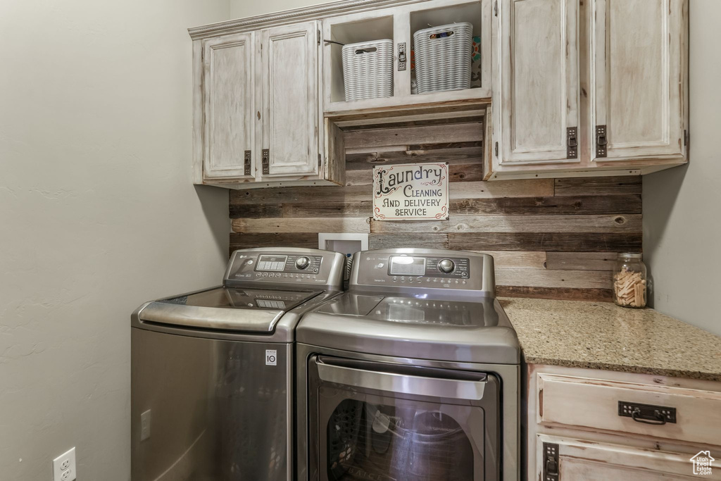 Laundry room with washing machine and dryer and cabinet space