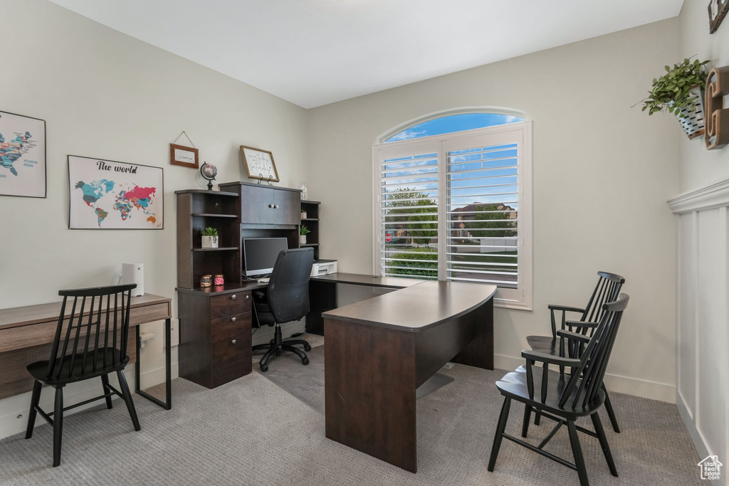 Office with light carpet and baseboards