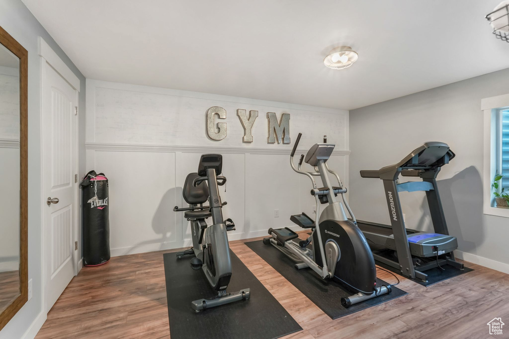 Workout area with wood finished floors
