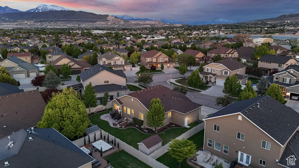 Aerial perspective of suburban area featuring a mountain backdrop