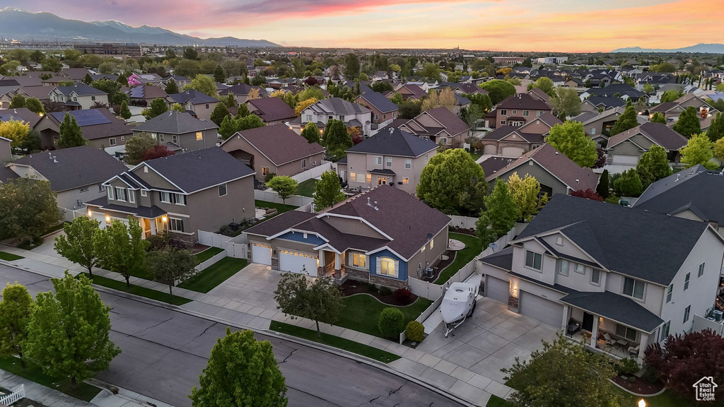 Aerial view of residential area featuring a mountainous background