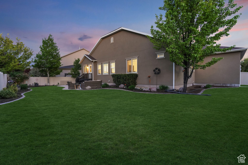 Back of house featuring stucco siding