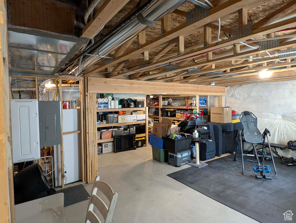 Unfinished below grade area featuring electric panel