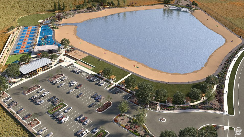Aerial view of property and surrounding area featuring a nearby body of water