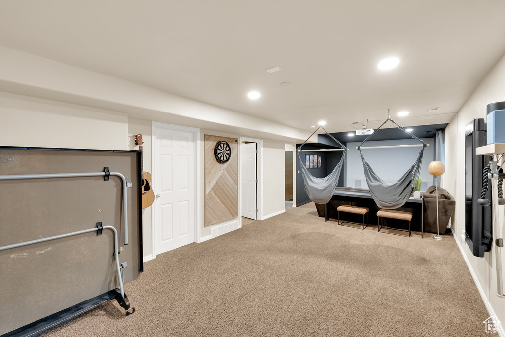 Exercise area with baseboards, carpet flooring, and recessed lighting