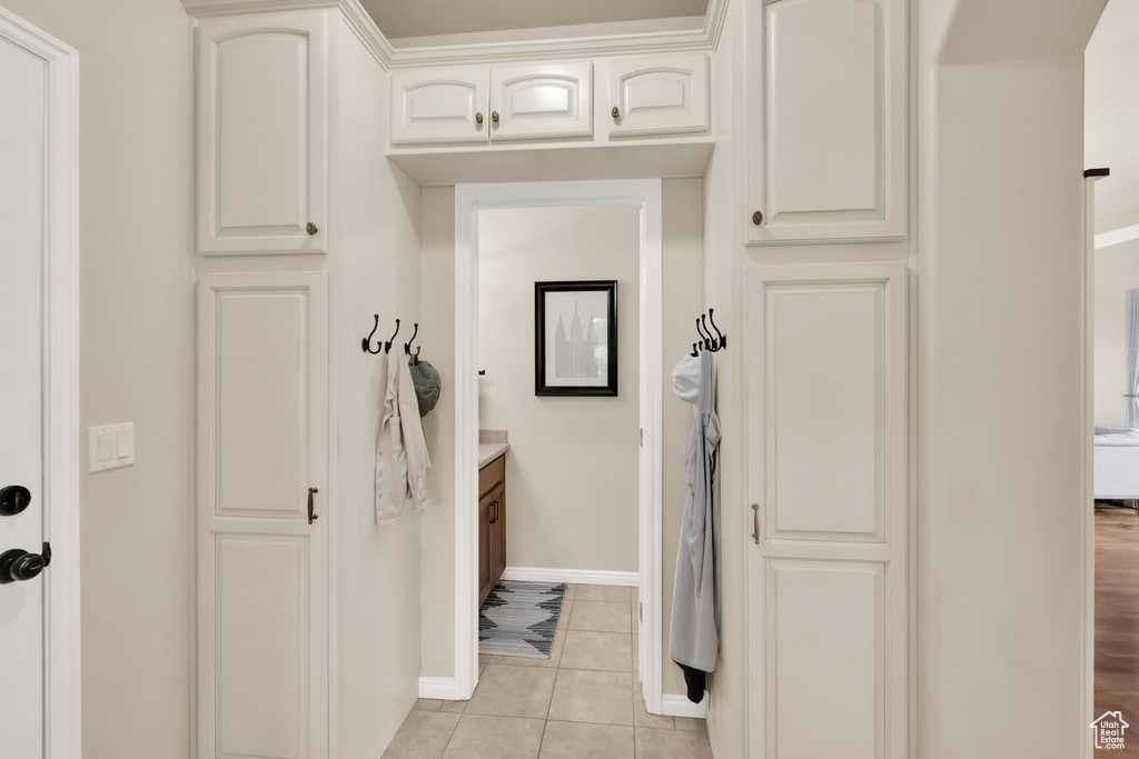 Mudroom with baseboards and light tile patterned floors