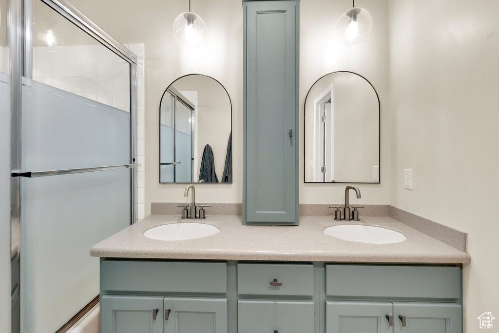 Full bathroom featuring a sink and double vanity
