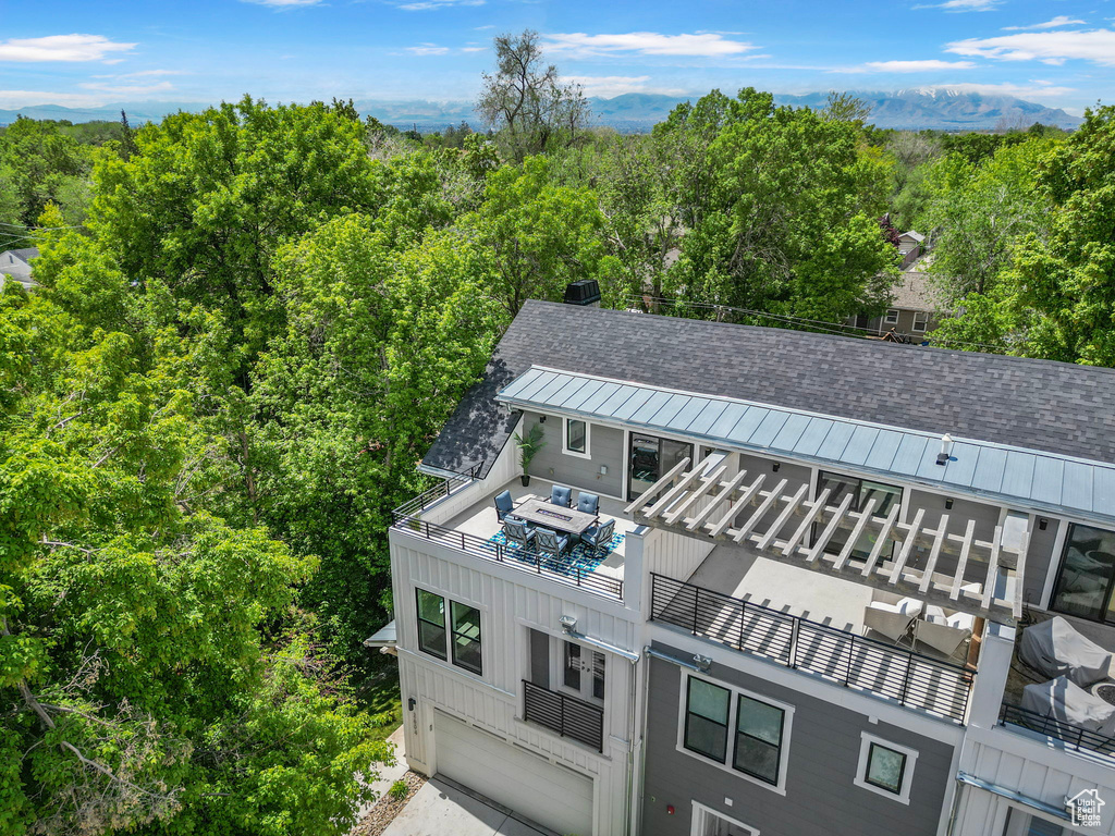 View of subject property with a heavily wooded area