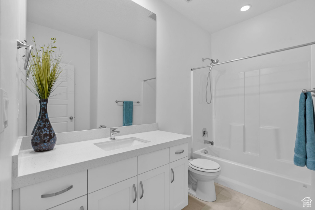 Full bath with vanity, toilet, bathing tub / shower combination, tile patterned flooring, and recessed lighting