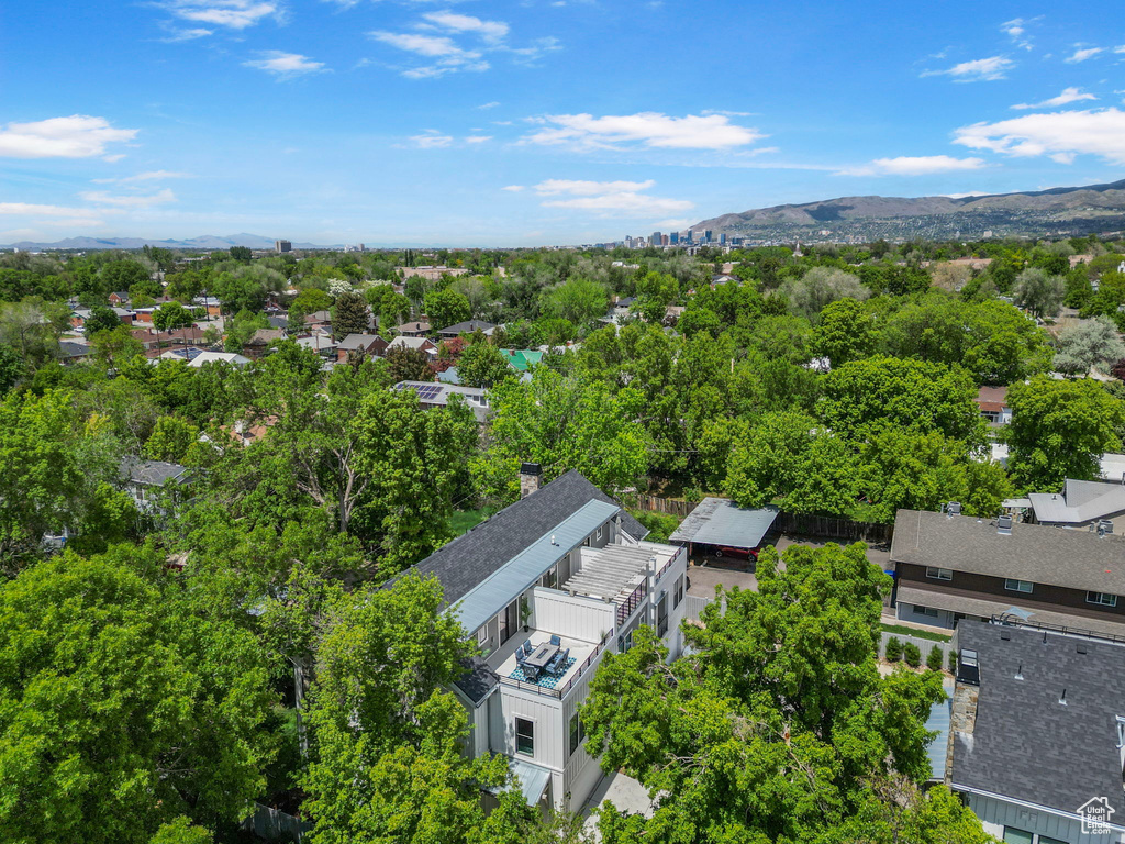 Drone / aerial view of mountains and a tree filled landscape