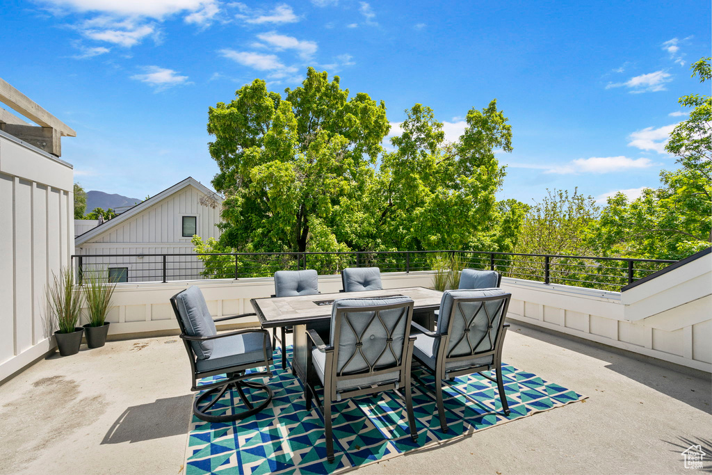 View of patio / terrace featuring outdoor dining space and fence