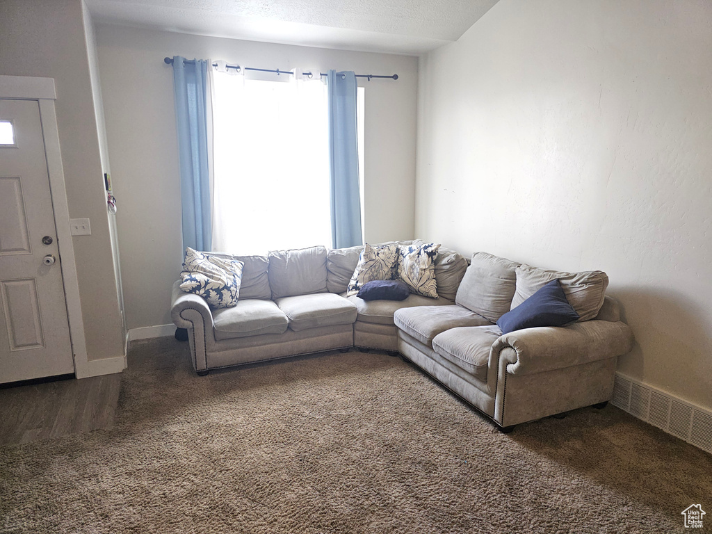 Living room with carpet and baseboards