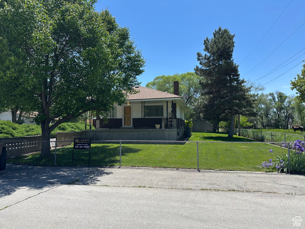 View of front of home featuring a chimney