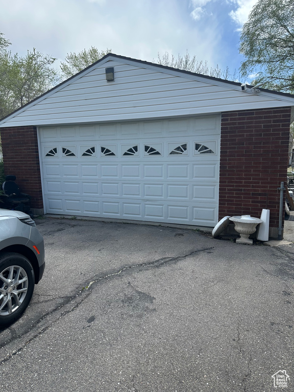 Garage featuring driveway