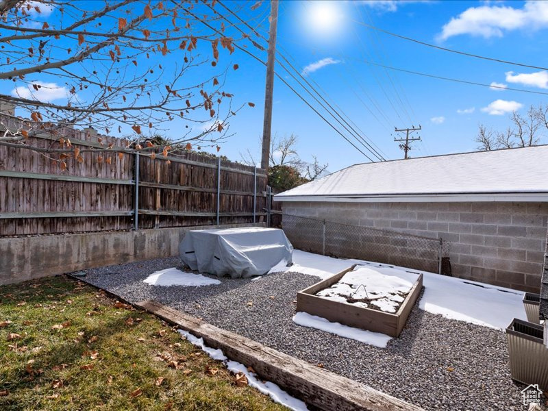 Entry to storm shelter featuring fence