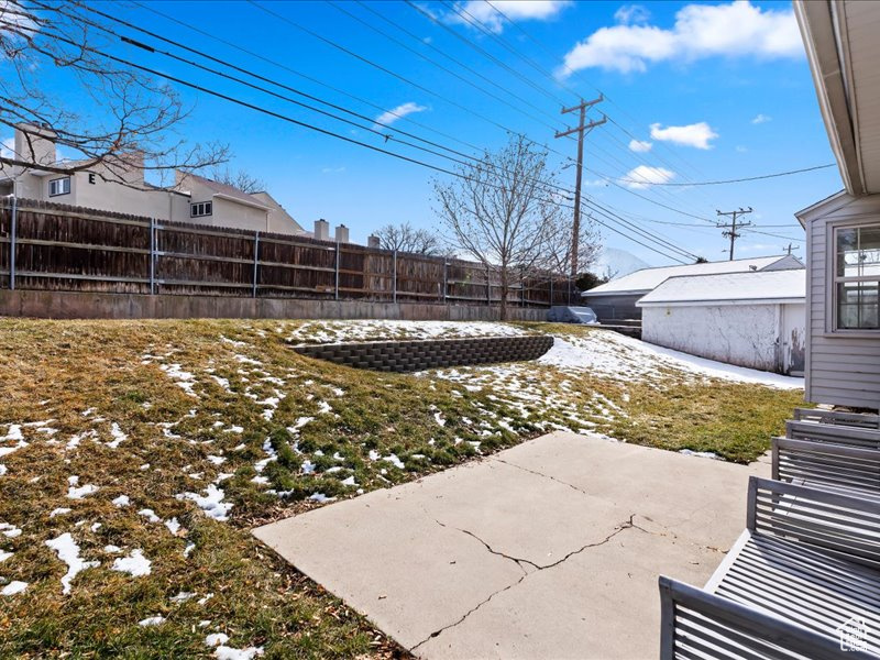 View of yard with a patio and a fenced backyard