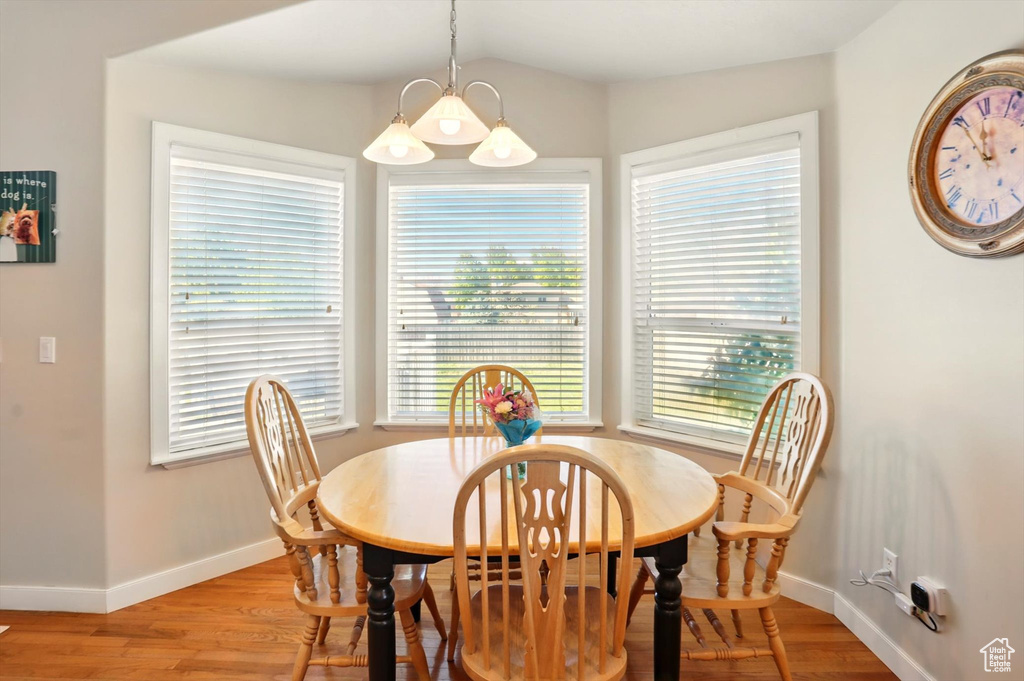Dining area featuring baseboards and light wood-style flooring