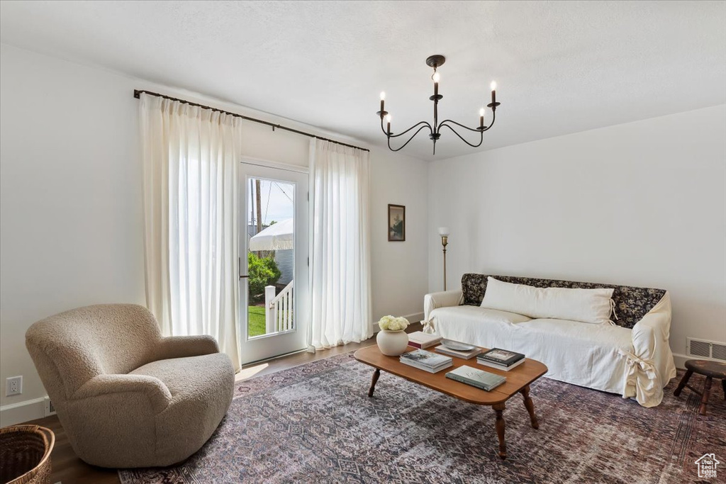 Living room with a chandelier and baseboards