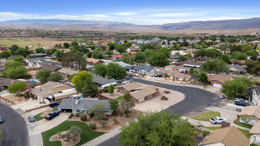 Birds eye view of property featuring a mountain view and a residential view