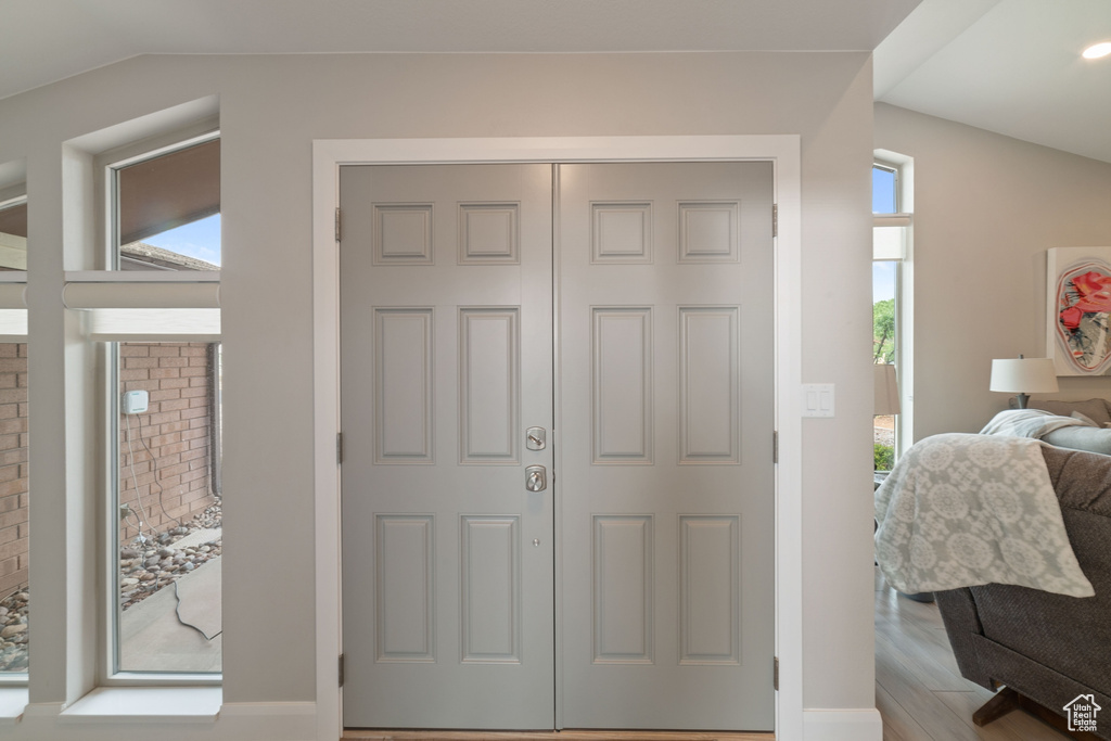 Entrance foyer with wood finished floors