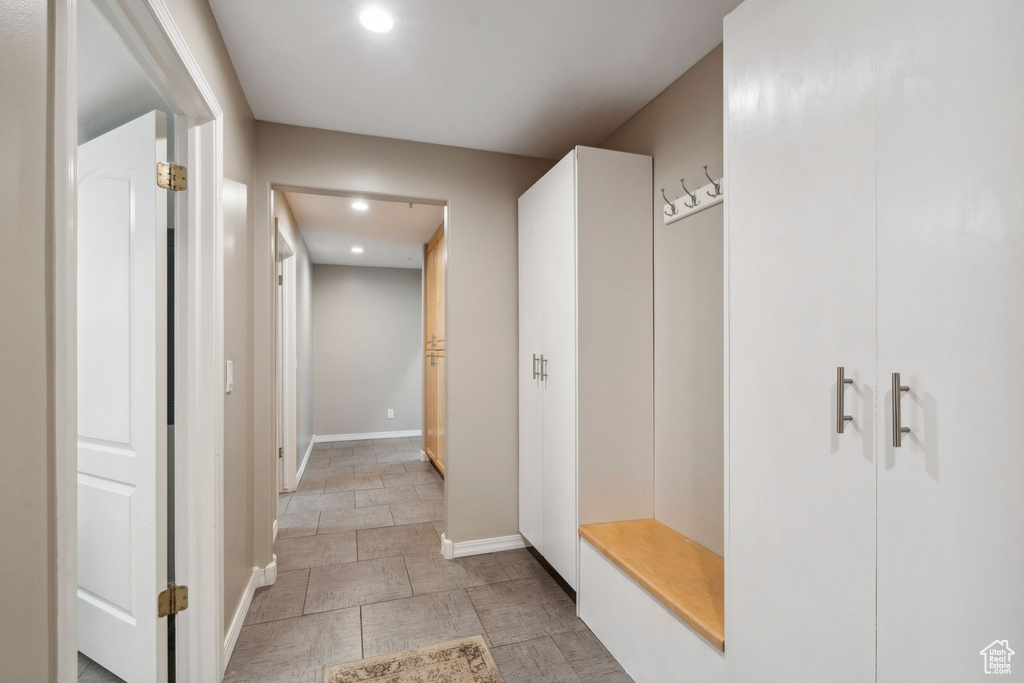 Mudroom with recessed lighting and baseboards