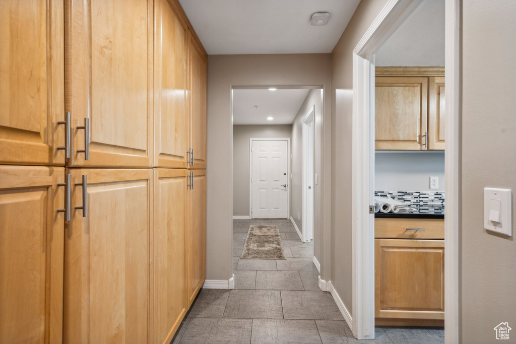 Hallway featuring baseboards and recessed lighting