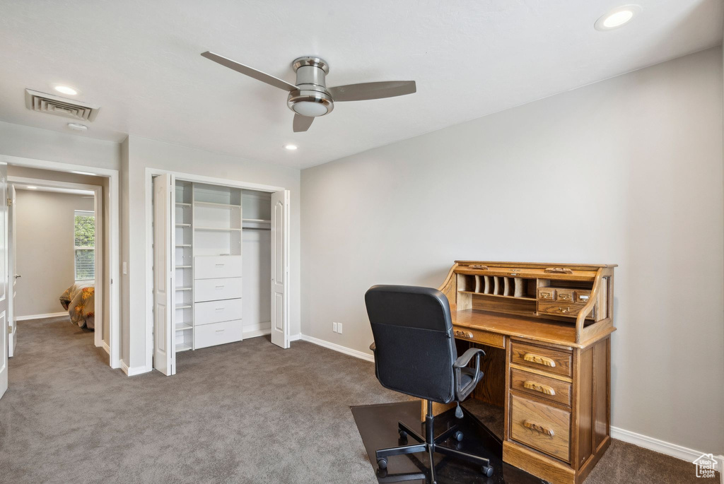 Carpeted office space featuring ceiling fan, recessed lighting, and baseboards