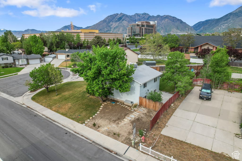 Aerial perspective of suburban area with a mountainous background