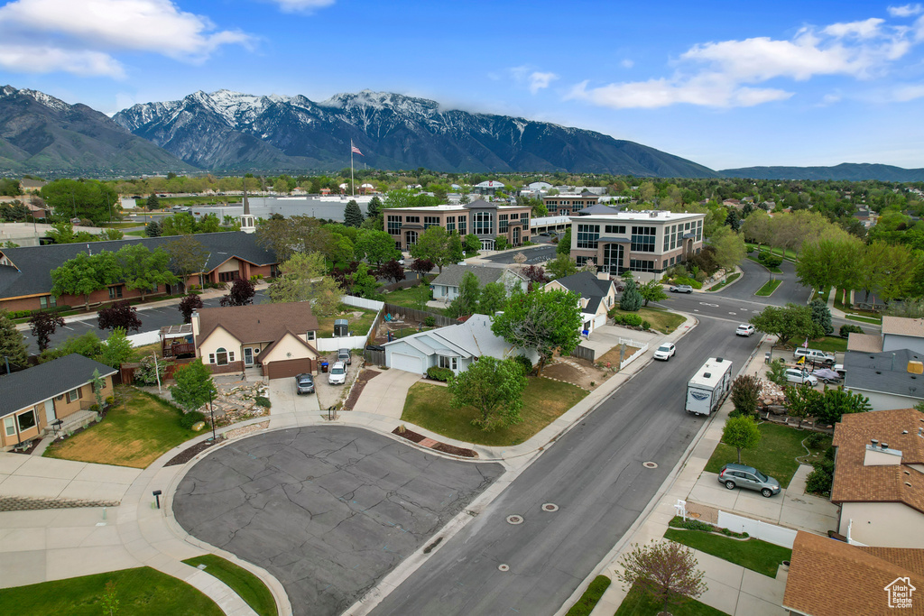 Aerial view of residential area featuring mountains