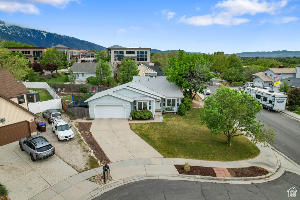 Aerial view of residential area featuring a mountainous background