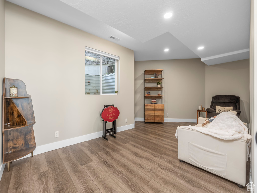 Sitting room featuring recessed lighting, baseboards, visible vents, and wood finished floors
