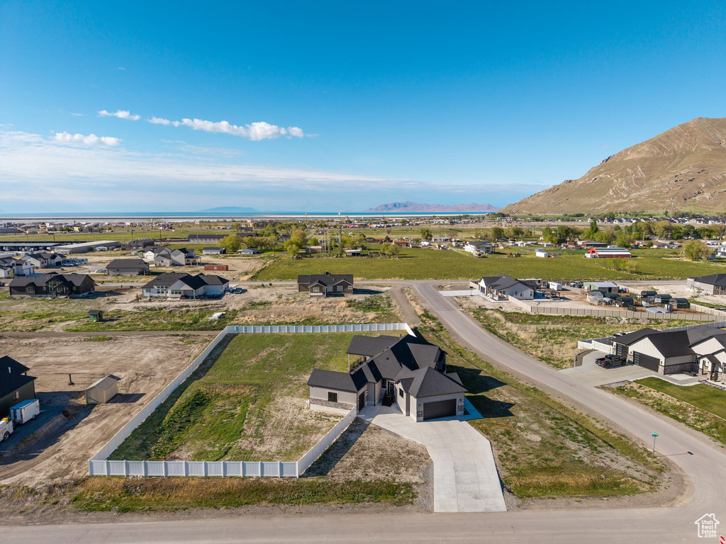 Birds eye view of property with a mountain view and a residential view