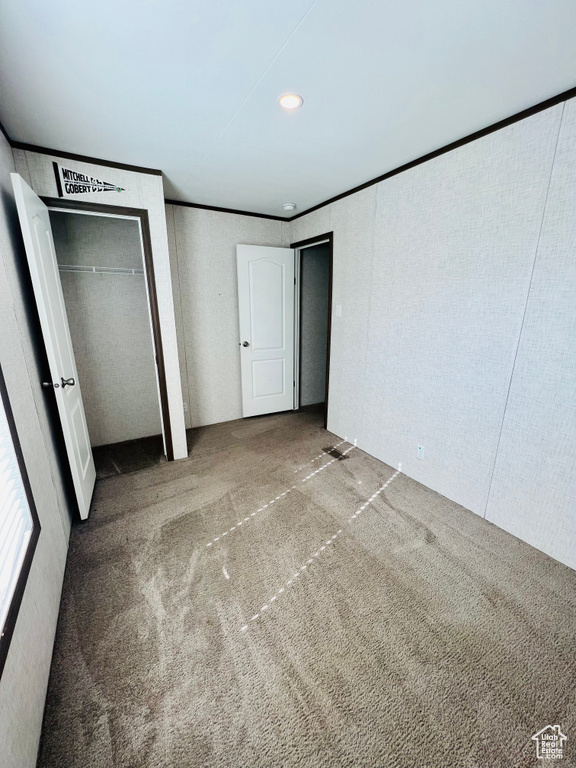 Unfurnished bedroom with carpet floors and recessed lighting