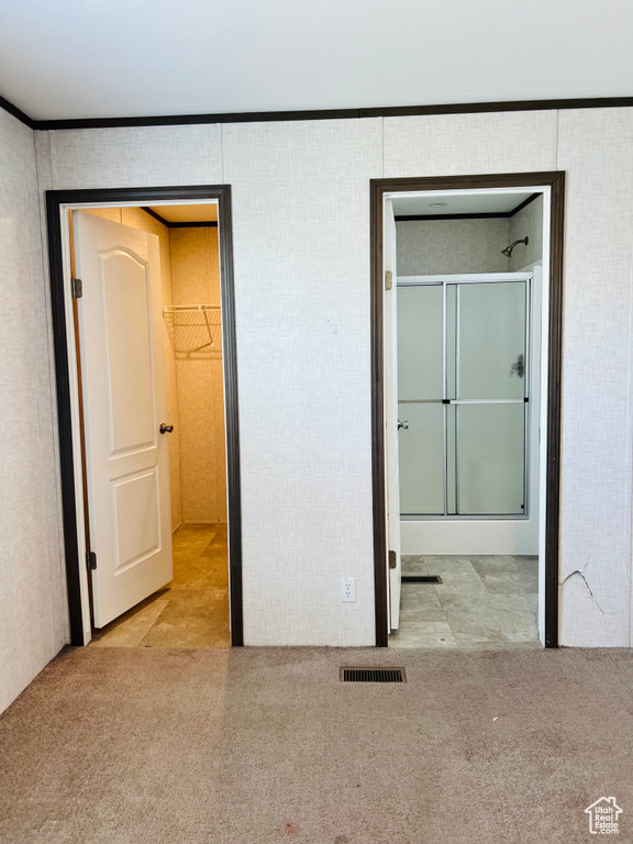 Unfurnished bedroom featuring carpet flooring and visible vents