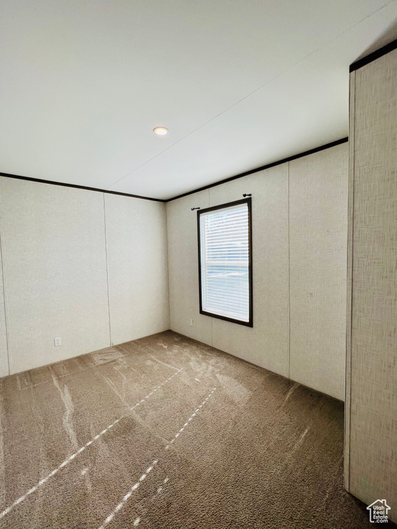 Empty room with carpet floors