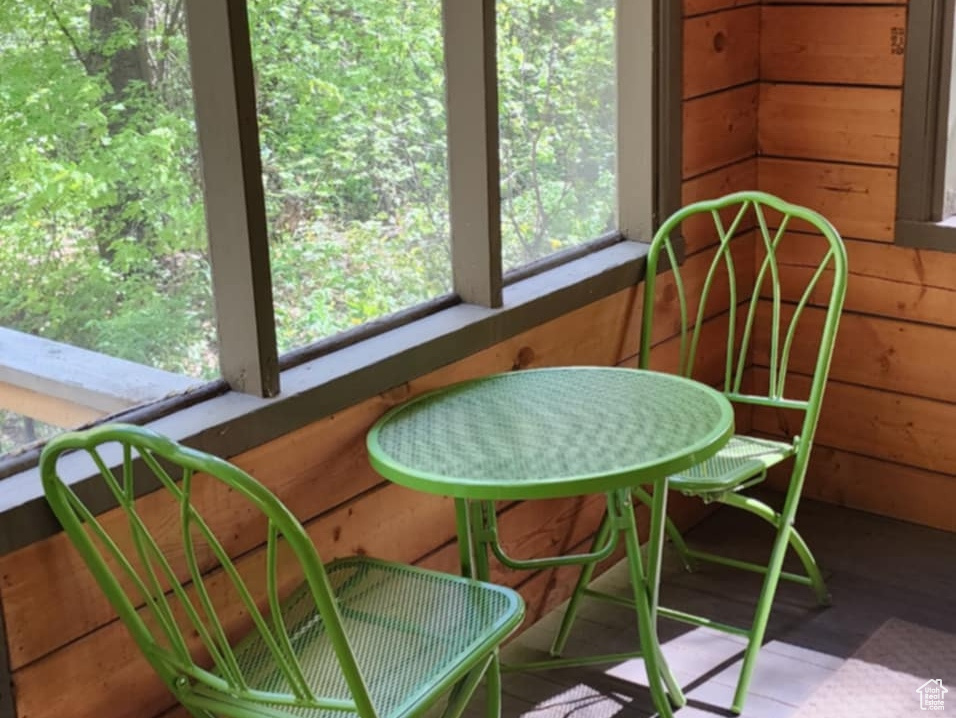 Sunroom / solarium featuring healthy amount of natural light