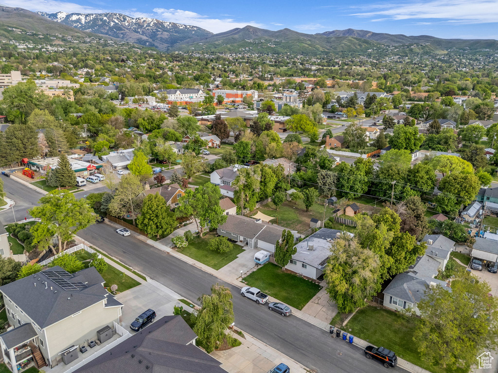 Aerial perspective of suburban area with a mountain backdrop