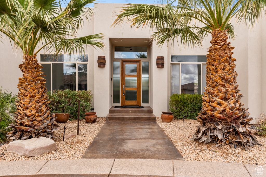 Property entrance with stucco siding