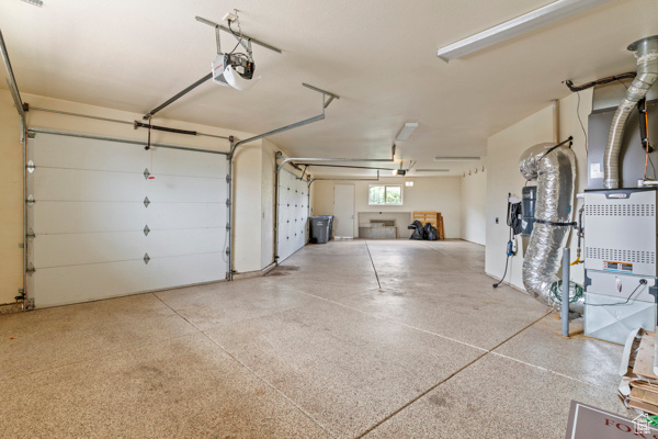 Garage featuring a garage door opener