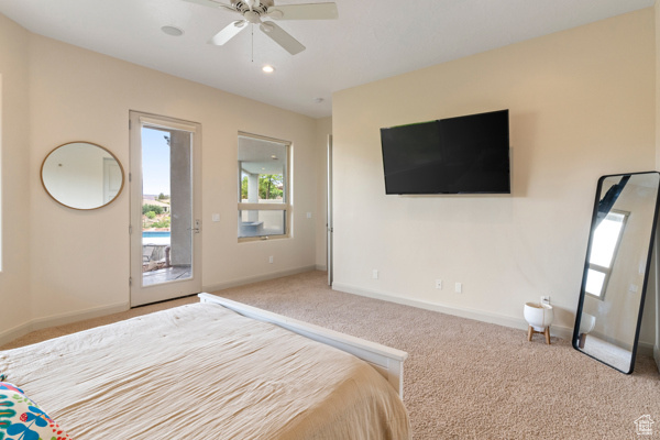 Carpeted bedroom with multiple windows, access to outside, baseboards, and recessed lighting