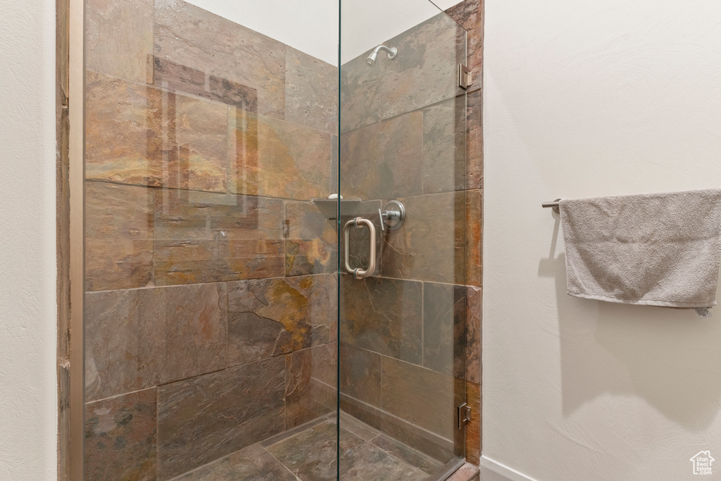 Bathroom featuring a shower stall