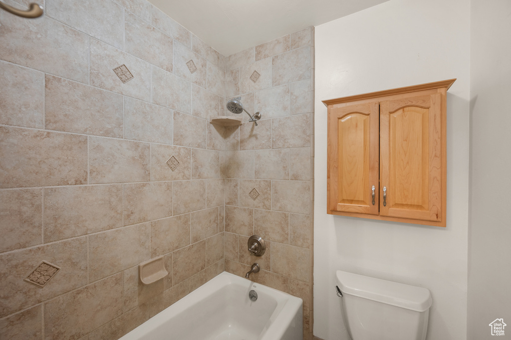 Full bath featuring bathing tub / shower combination and toilet