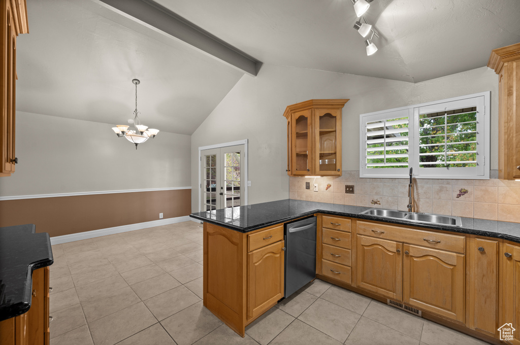 Kitchen featuring dishwasher, a sink, a peninsula, glass insert cabinets, and tasteful backsplash