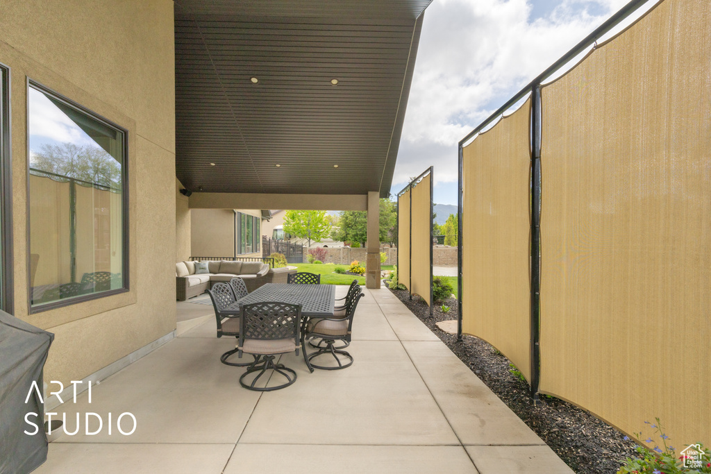 View of patio / terrace with outdoor lounge area, fence, and outdoor dining space