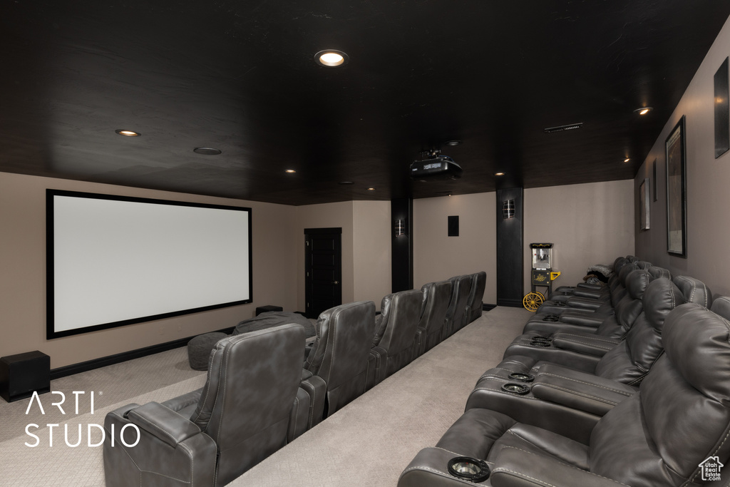 Home theater with light carpet and recessed lighting