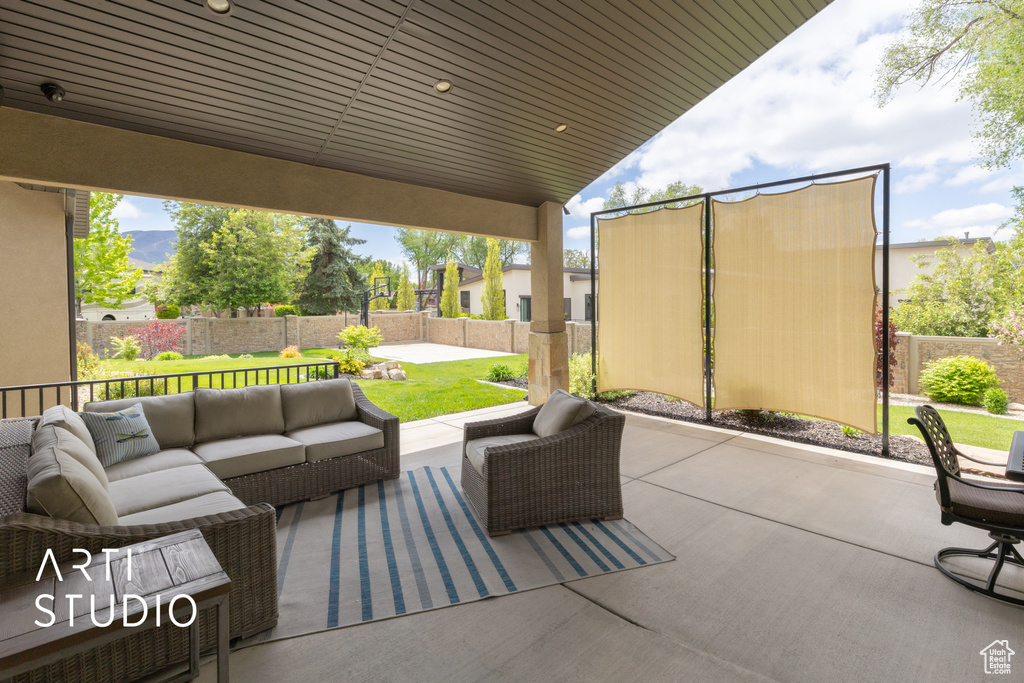 View of patio with an outdoor living space