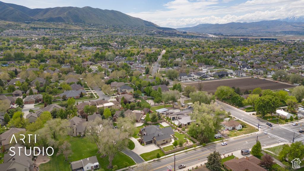 Aerial perspective of suburban area featuring a mountainous background